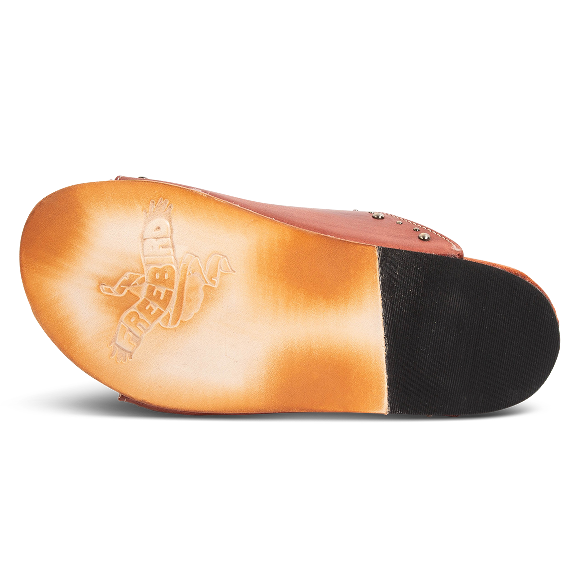 Leather sole with a tread heel imprinted with FREEBIRD on women's Asher rust sandal