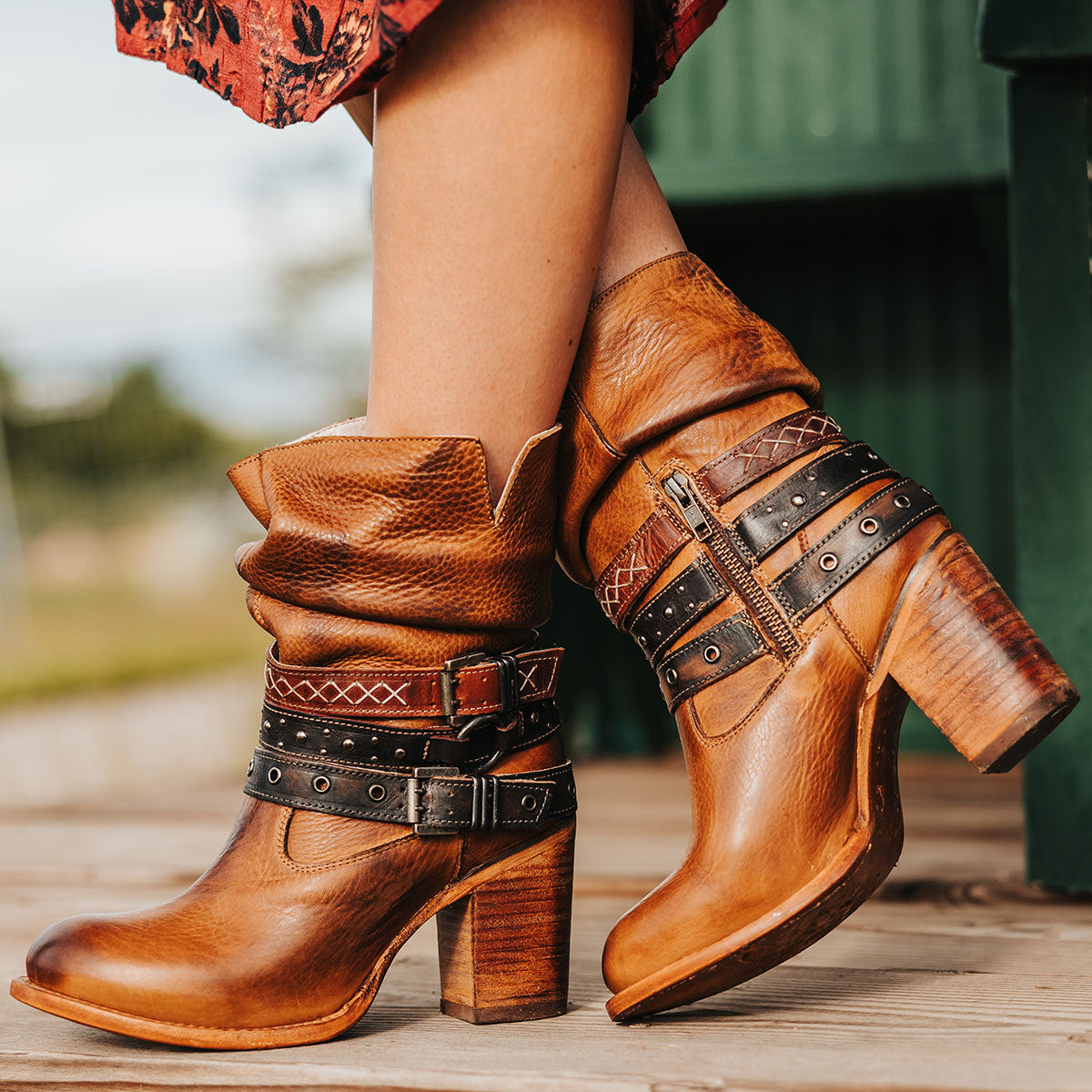 FREEBIRD women's Blaine tan leather bootie with adjustable shaft belts, round toe construction and inside working zipper