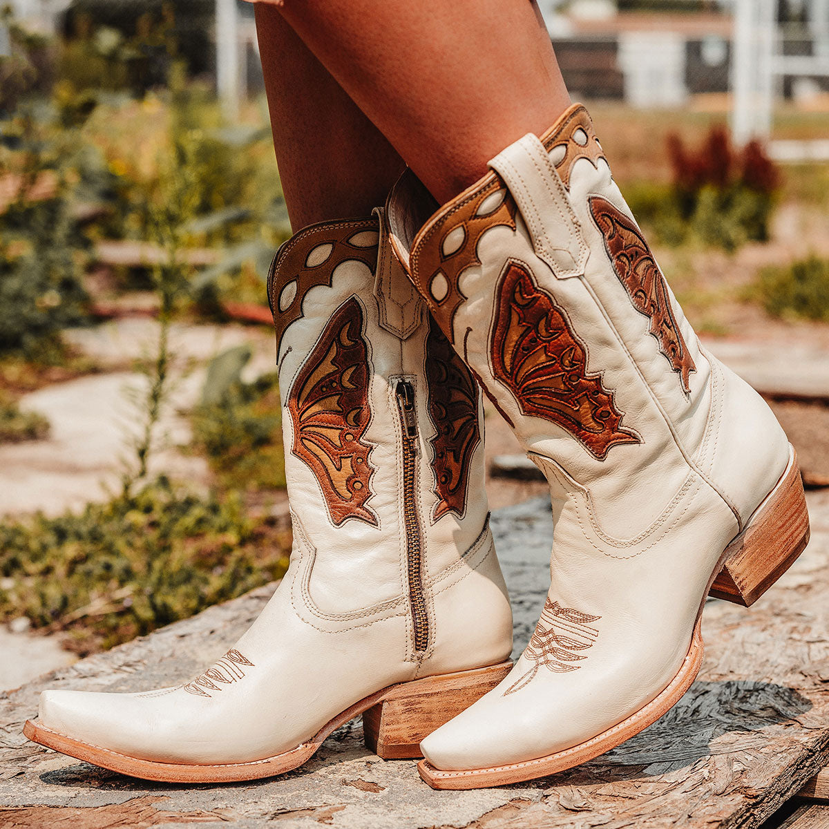 FREEBIRD women's Butterfly bone multi leather boot with laser cut detailing, a slant heel and snip toe construction