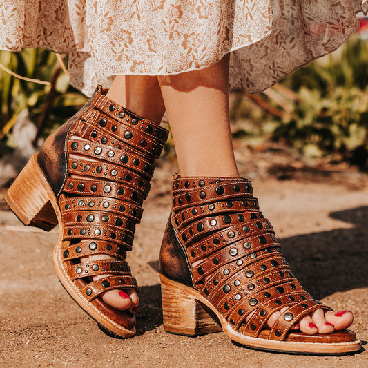 FREEBIRD women's Cannes cognac leather sandal with studded leather straps, working brass zipper and stacked heel