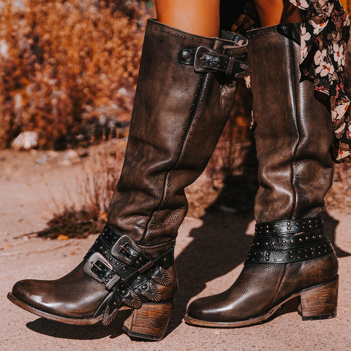 FREEBIRD women's Cleo black distressed leather tall boot with decorate belts, embossed studs and gore detailing