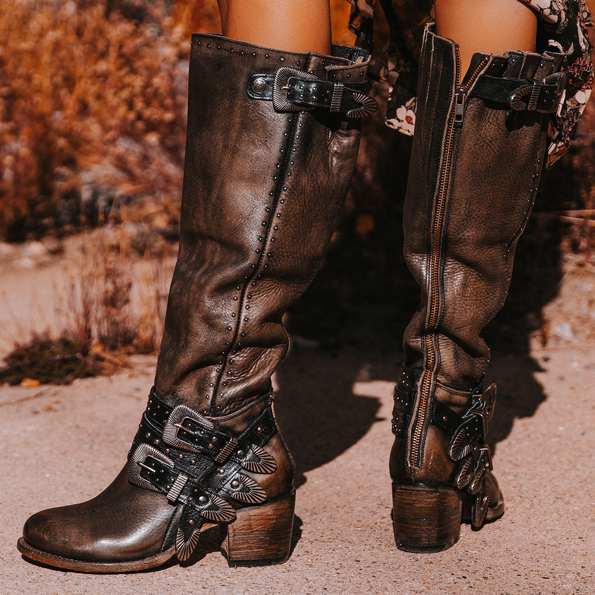 FREEBIRD women's Cleo black distressed leather tall boot with decorate belts, embossed studs and gore detailing