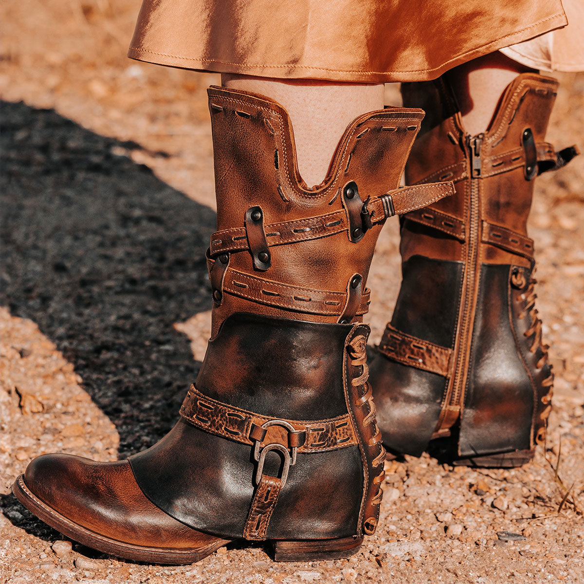 FREEBIRD women's Crow cognac multi leather boot with a leather overlay, back panel decorative lacing and inside working zipper