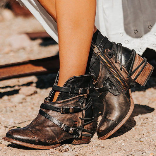 FREEBIRD women's Crue black distressed leather cutout ankle bootie with silver hardware straps and back lacing detail 