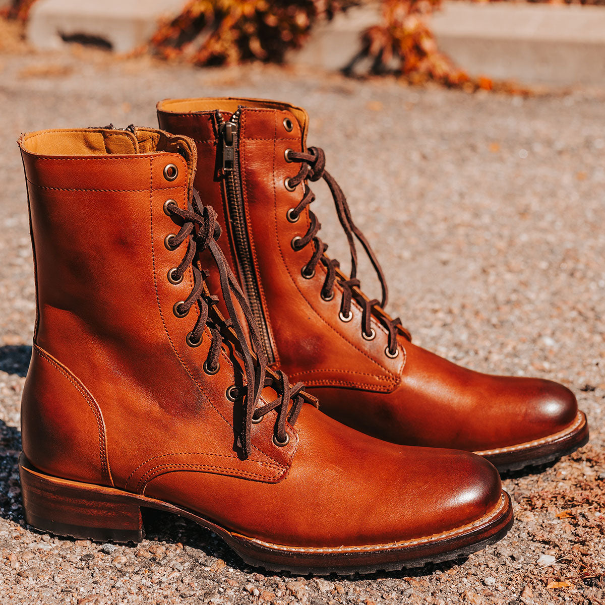 FREEBIRD men's Denver rust leather boot with front tie leather lacing, inside working brass zipper and elevated heel