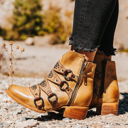 FREEBIRD women's Grady beige leather bootie with an inside working zipper, low bock heel and abstract shaft belt detailing