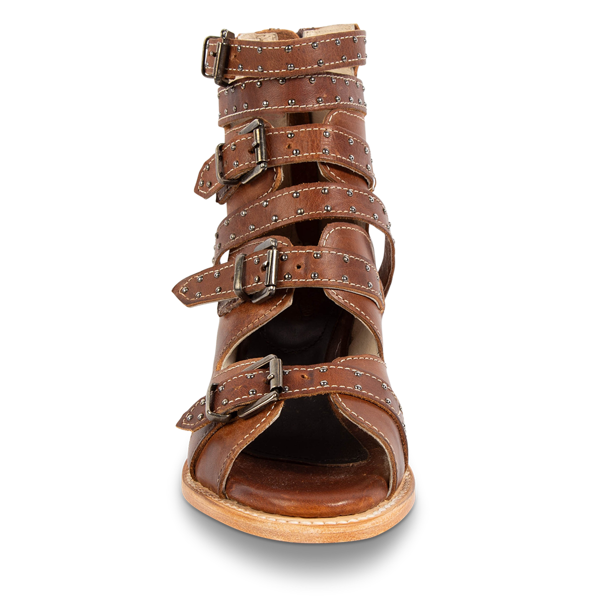 Front view showing an open silhouette and adjustable leather straps with stud embellishments on FREEBIRD women's Gunnar cognac leather sandal