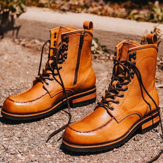 FREEBIRD men's Idaho whiskey leather boot with front tie lacing, a Goodyear welt and working brass zipper 