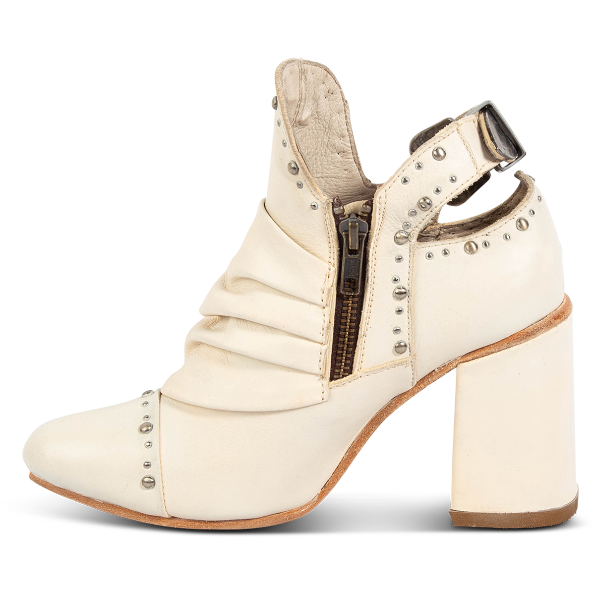 Inside view showing a working brass zipper, silver embellishments and leather overlay on FREEBIRD women's Jericho beige leather bootie