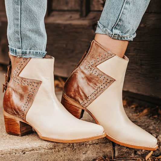 FREEBIRD women's Matilda beige multi leather bootie with a two-tone shaft, stud embellishments and working back zipper