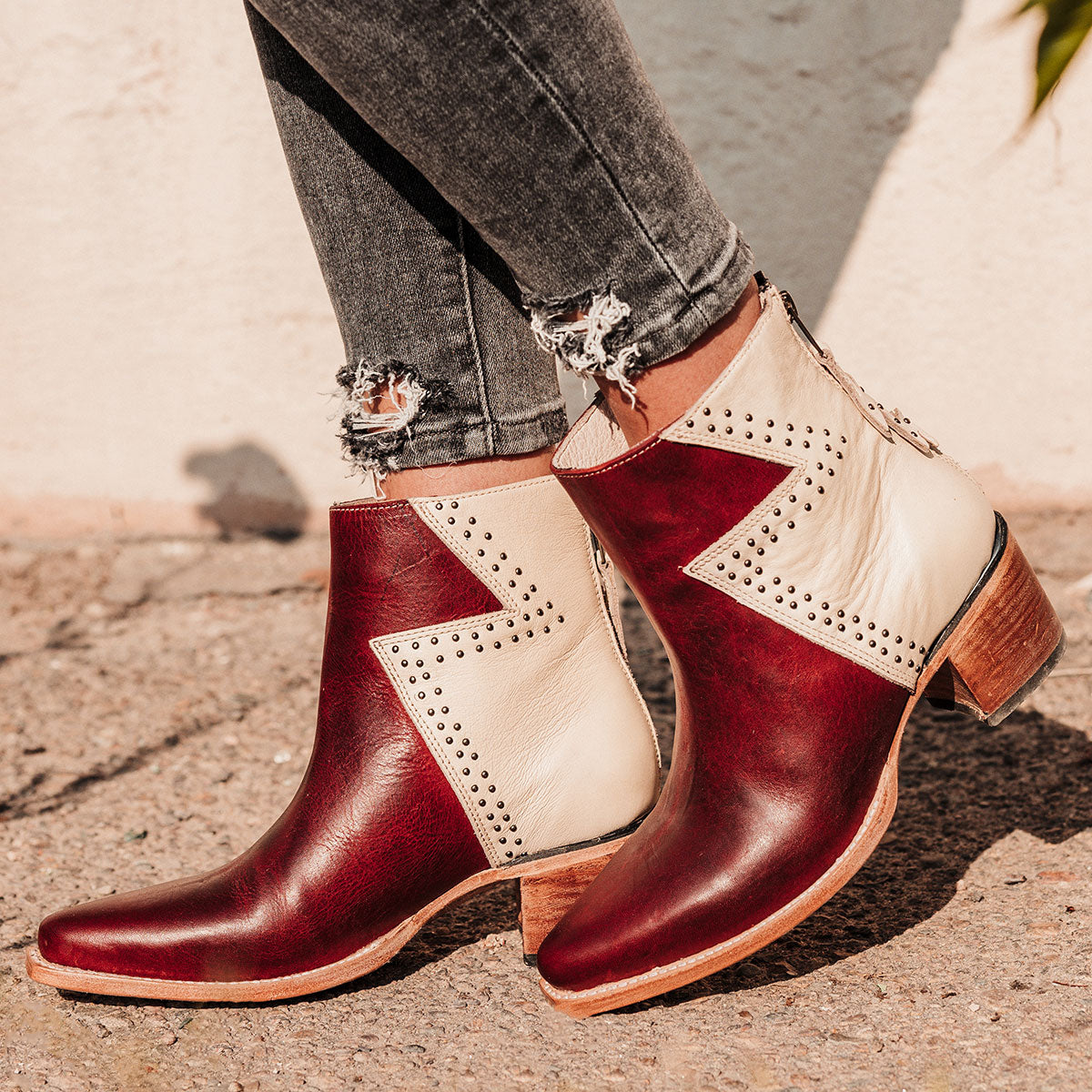 FREEBIRD women's Matilda red multi leather bootie with a two-tone shaft, stud embellishments and working back zipper