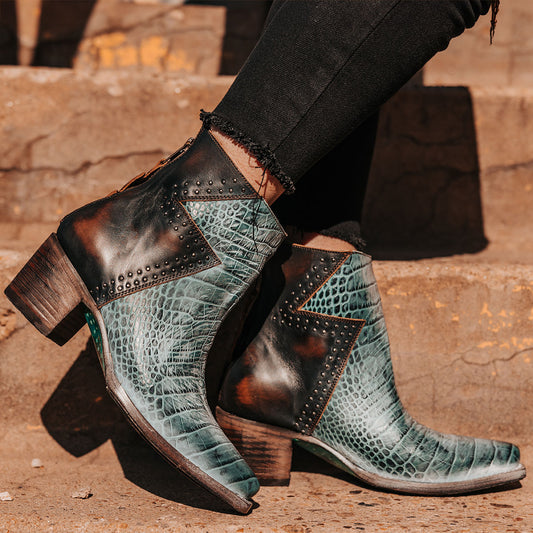 FREEBIRD women's Matilda turquoise croco multi leather bootie with a two-tone shaft, stud embellishments and working back zipper