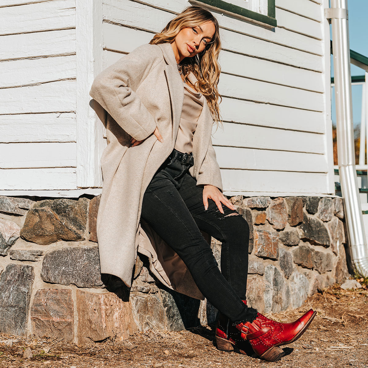 FREEBIRD women's Morgan red leather ankle bootie with silver stud embellishments, gore detailing, and buckle straps lifestyle