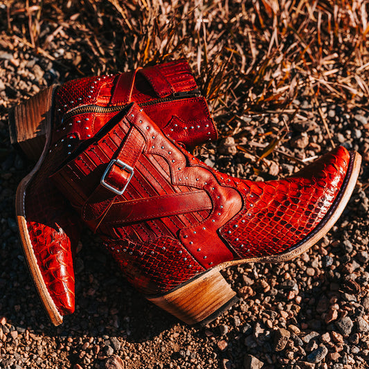 FREEBIRD women's Morgan red python leather ankle bootie with silver stud embellishments, gore detailing, and buckle straps