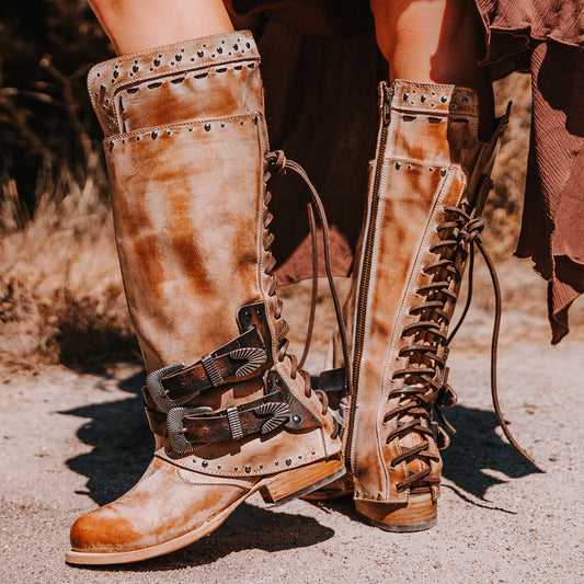 FREEBIRD women's Ramona taupe leather boot with a full inside working zipper, adjustable back tie lacing and decorative stud embellishments