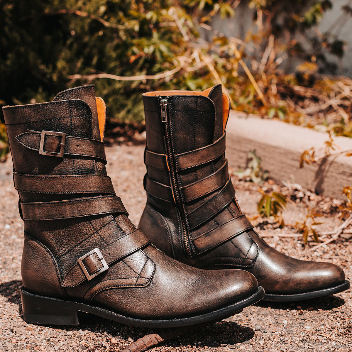 FREEBIRD men's Rumble black distressed leather boot with adjustable leather straps, a working brass zipper and stacked heel