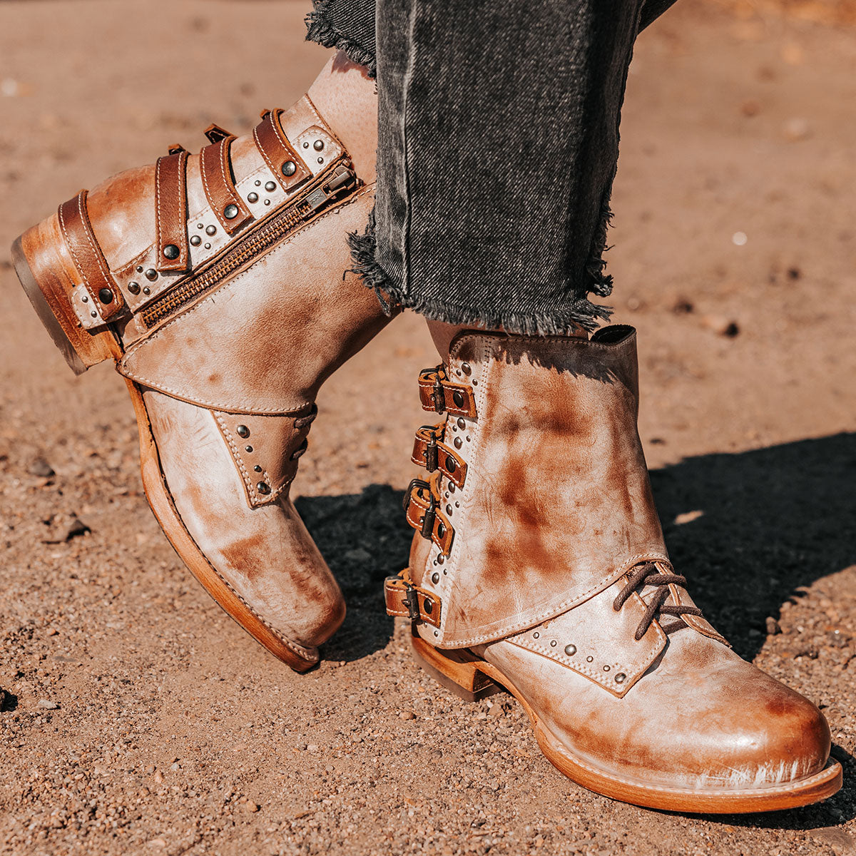 FREEBIRD women's Rynn taupe leather bootie with a protective leather overlay, front tie lacing and side snap closures