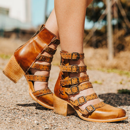 FREEBIRD women's Salty wheat leather bootie with adjustable leather straps, a low block heel and an almond toe
