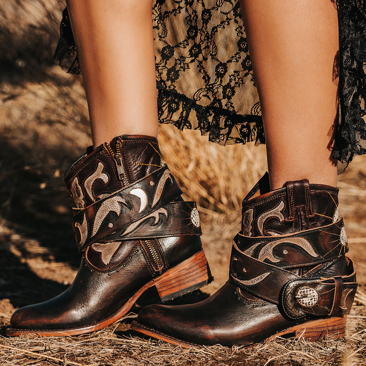 FREEBIRD women's Tash brown multi leather bootie with an inside working zipper, removable belt and laser cut detailing